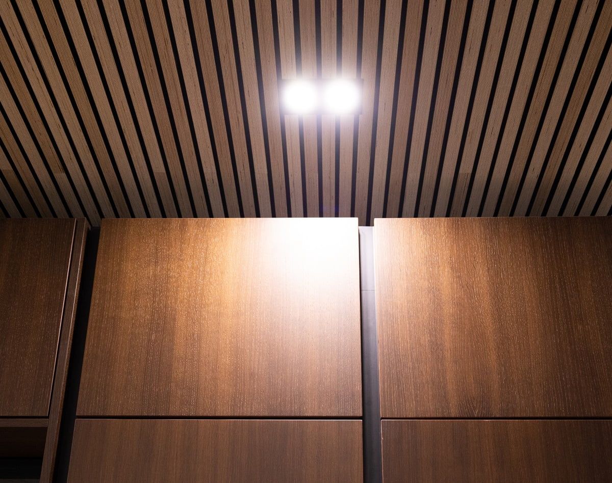 Spotlights in front of the kitchen cabinets provide light for a convenient working area. © LedStore.fi